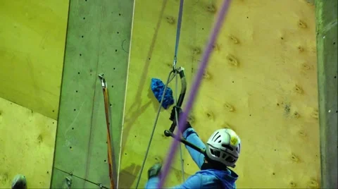 An experienced climber is moving steadily upward. Success. Mountain Stock Footage 69034205