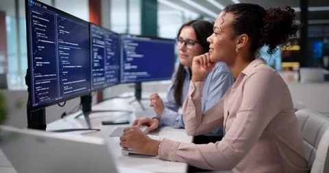 Experienced Coder Mentors Young Programmer To Troubleshoot Complex Software G Stock Photos