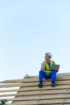 Experienced construction worker contemplating project details and future de.. Stock Photos