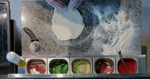 Experienced cooker making pizza using traditional recipe, professional kitchen Stock Footage 158996502
