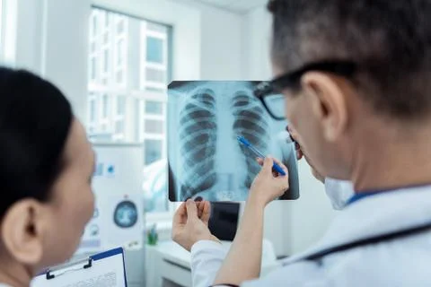 Experienced doctors detecting problems on radio scan Stock Photos