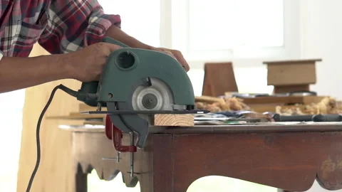 Experienced elderly carpenter focuses on his work in carpentry shop, small .. Stock Footage 243191073