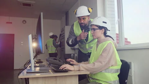 Experienced energy engineers work at computer in office Stock Footage 143239155