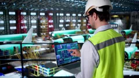Experienced Engineer Monitors Aerospace Factory Machines Stock Footage 334931160