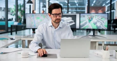 Experienced Engineer Using BIM And GIS Software To Design Real Property Maps. Stock Photos