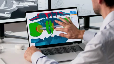 Experienced Engineer Using Laptop To Design Turbine Model Stock Footage 334931551