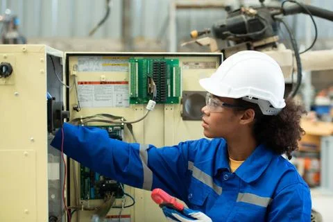Experienced female electrical engineer The electrical system of the weldin... 写真素材