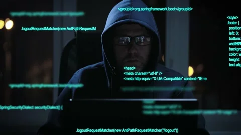 An experienced hacker works with code when breaking into security systems. A Stock Footage 177312340