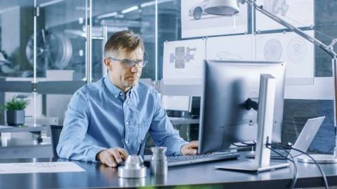 Experienced Industrial Engineer Working on Personal Computer in the Stylish,  Stock Photos