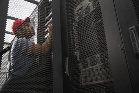 Experienced IT engineer running software Stock Photos