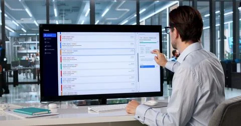 Experienced IT Support Specialist Managing Help Desk Ticket Workflow On Large Stock Photos