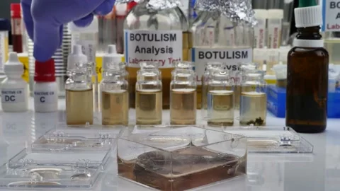Experienced laboratory scientist analyzing a sample from a canned food can, botu Video stock 130274990