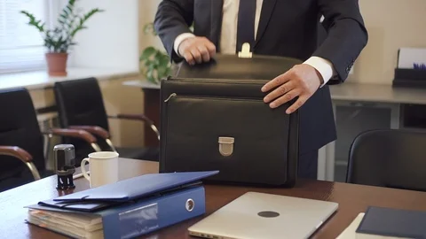 Experienced lawyer putting contract to suitcase in office going to court. Stock Footage