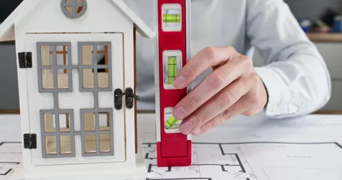 Experienced man architect carefully studies house sketch Stockbeeldmateriaal 314728738