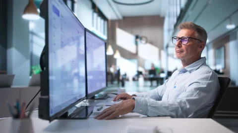 Experienced Marketing Manager Carefully Analyzes Campaign Data Stock Footage 343883787