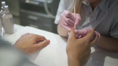 Experienced nail master making perfect manicure on mans hands Stock Footage 114009149