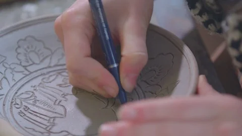Experienced potter creating a beautiful clay souvenirs using professional tools 스톡 동영상 84171437