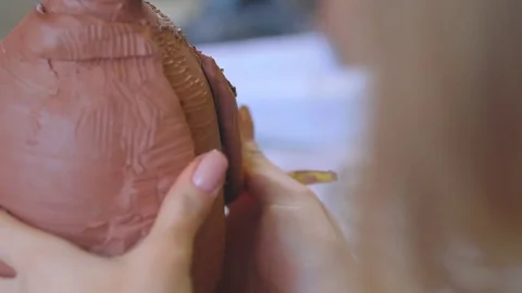 Experienced potter creating a beautiful clay souvenirs using professional tools 스톡 동영상 84172157
