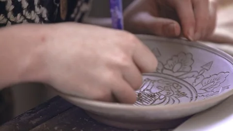 Experienced potter creating a beautiful clay souvenirs using professional tools 스톡 동영상 84172523
