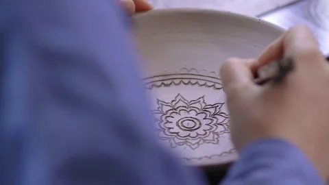 Experienced potter creating a beautiful clay souvenirs using professional tools 스톡 동영상 84172941