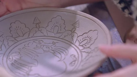 Experienced potter creating a beautiful clay souvenirs using professional tools Stock Footage 84178590