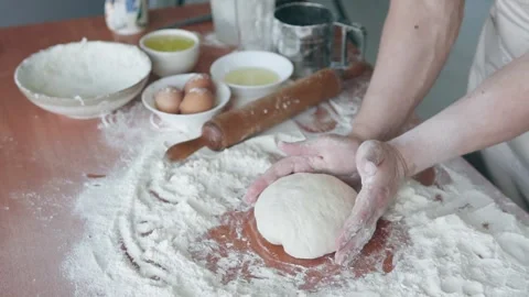 Experienced professional chef, baker shapes dough and starts preparing bread. Stock Footage 300179945