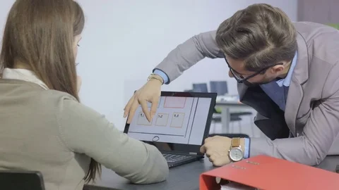 Experienced professional commenting the sketches on a touchscreen Stock Footage 73994067