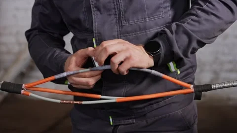 Experienced Professional Methodically Employs Heat And Adhesive For Wiring Joint Stock Footage 323793197
