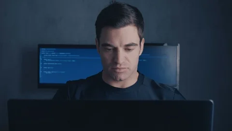 Experienced Programmer Developer works on a new program Young man writes the Stock Footage 102050507