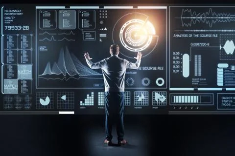 Experienced programmer standing with his hands up and looking at the screen 스톡 사진