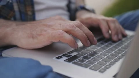 An experienced programmer types program code on the keyboard, close-up of the Stock Footage 154896273