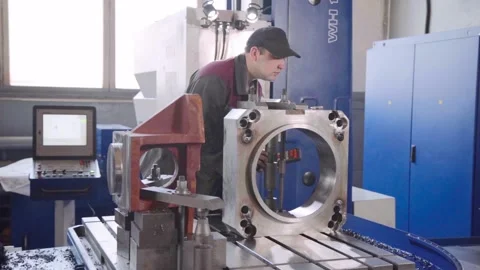 Experienced qualified worker works on precision coordinate boring machine CNC Stock Footage 105164058