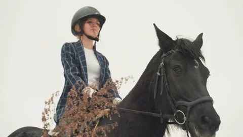 Experienced rider practicing outdoors in cloudy weather. Focused female Stock Footage 338436966