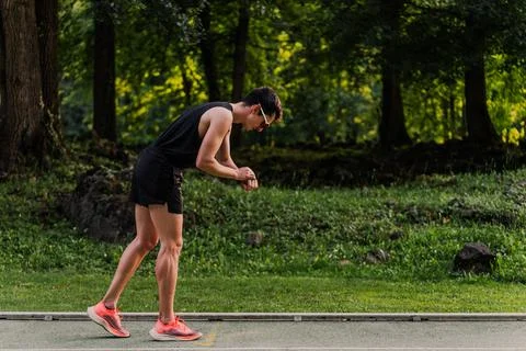 Experienced runner controlling his time during a training session. Copy space Stock Photos