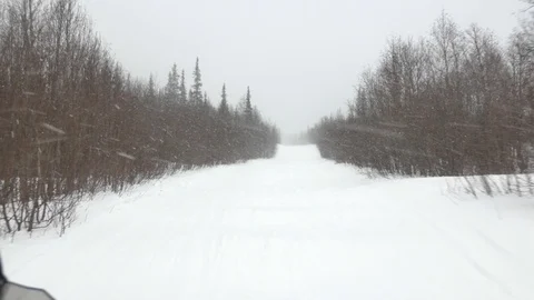 Experienced snowmobile driver moves along meandering track Stock-Footage 108545201