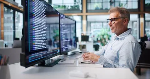 Experienced Software Developer Coding Remotely Using Cloud-based IDE Tools. Stock Photos