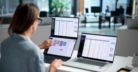 Experienced Software Developer Writing Code Collaboratively On Dual Touchscre Fotos Stock