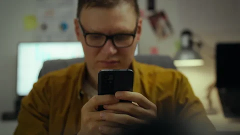 Experienced specialist at home programming making edits for smartphone users Stock Footage 281107440