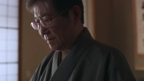 Experienced tea master preparing a bowl of tea during a tea ceremony in a tradit Stock Footage 199457515