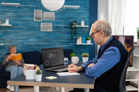 Experienced technician taking notes on notebook 스톡 사진