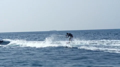 Experienced Wake Boarder Dragged Behind The Powerboat Stock Footage 125863620