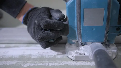 Experienced worker in black gloves cuts white drywall macro Stock Footage 108582909