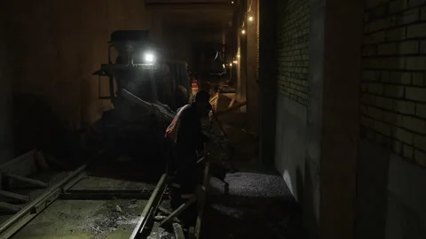 Experienced workers diligently work in tunnel of metro new line Stock Footage 296713406