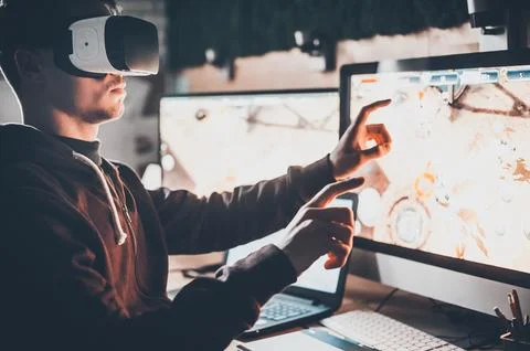 Experiencing virtual reality. Handsome young man wearing virtual reality he.. Foto stock