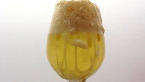 Experiment Bubbling Lava Lamp With Foam Running Over Wine Glass. Close Up Stock Footage 83007746