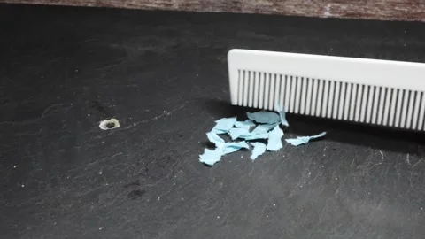 Experiment with a comb for static charging by means of friction Stock-Footage 342614817