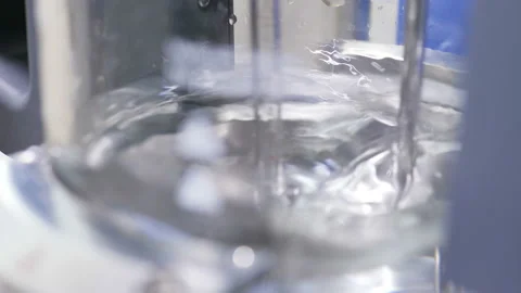 Experiment with mixed clear liquid on test device in lab Stock Footage 99156300
