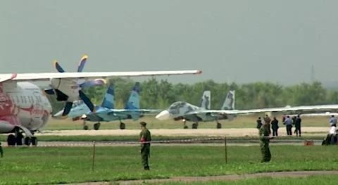 Experimental Su-47 Berkut and Su-27SM, Su-30SM and Su-35 are moving along runway Stock Footage 172192251