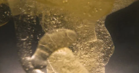 Experiments on Different reactions of bubbles in oil Stock Footage 107902140