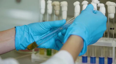 Experiments with tubes in bio lab Stock Footage 63613720